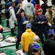 An auctioneer gestures during one of the the first tuna auctions on the opening day of the new Toyosu fish market.